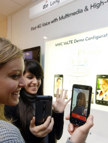 Two female models are demonstrating Video Call via LTE in LG’s booth