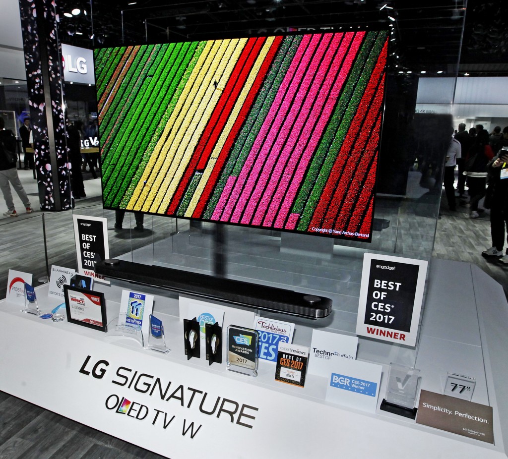 LG’s revolutionary new LG SIGNATURE W7 OLED 4K TV on display with its numerous awards placed in front at CES 2017.