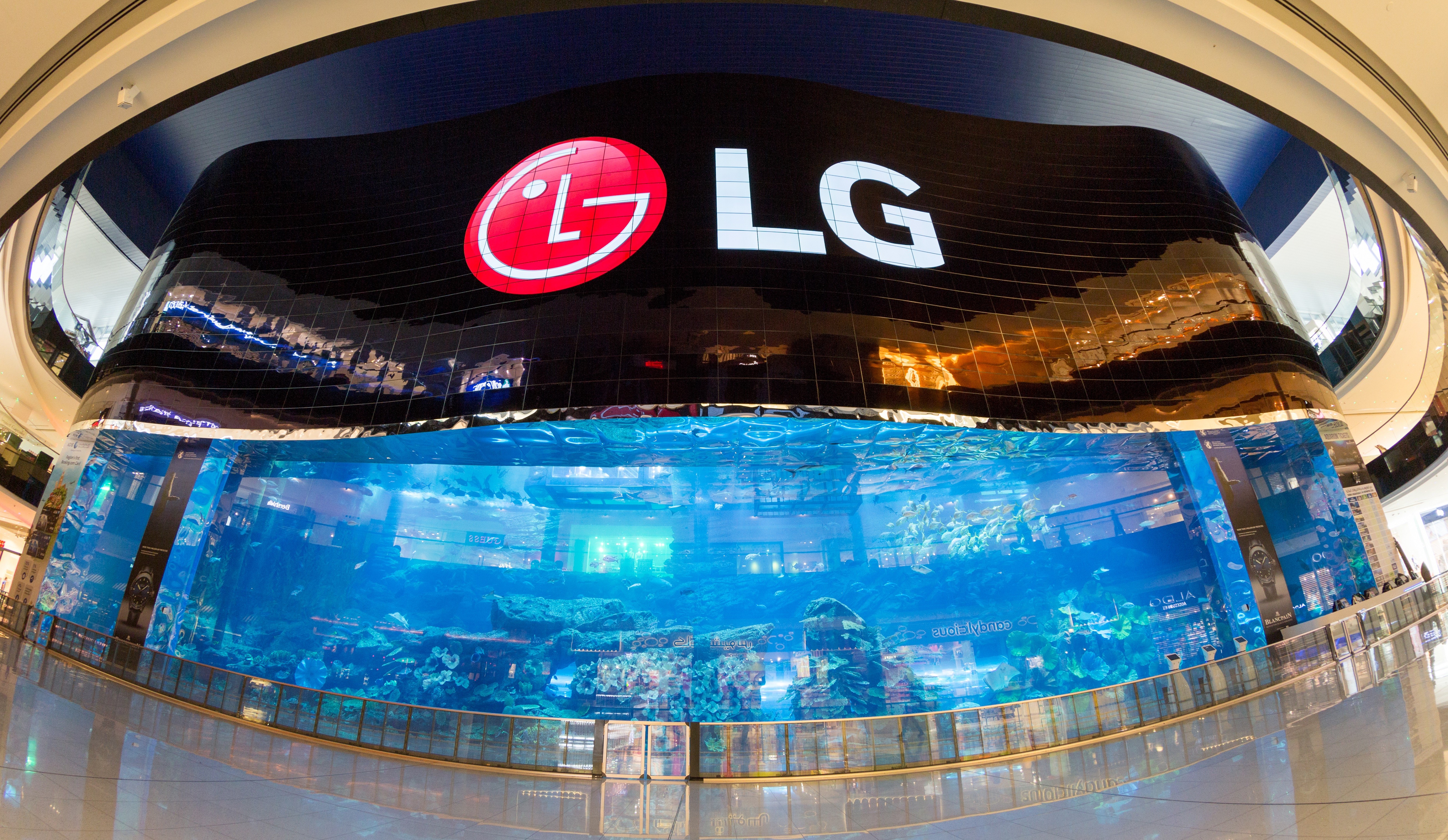A gigantic LG OLED video wall signage displaying the logo of LG at the Dubai Aquarium.