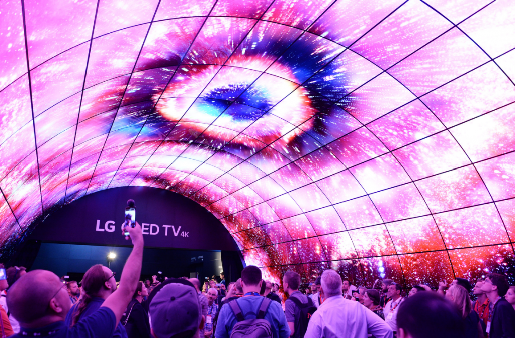 Visitors to LG’s booth at IFA 2017 admiring and taking photos of the LG OLED tunnel