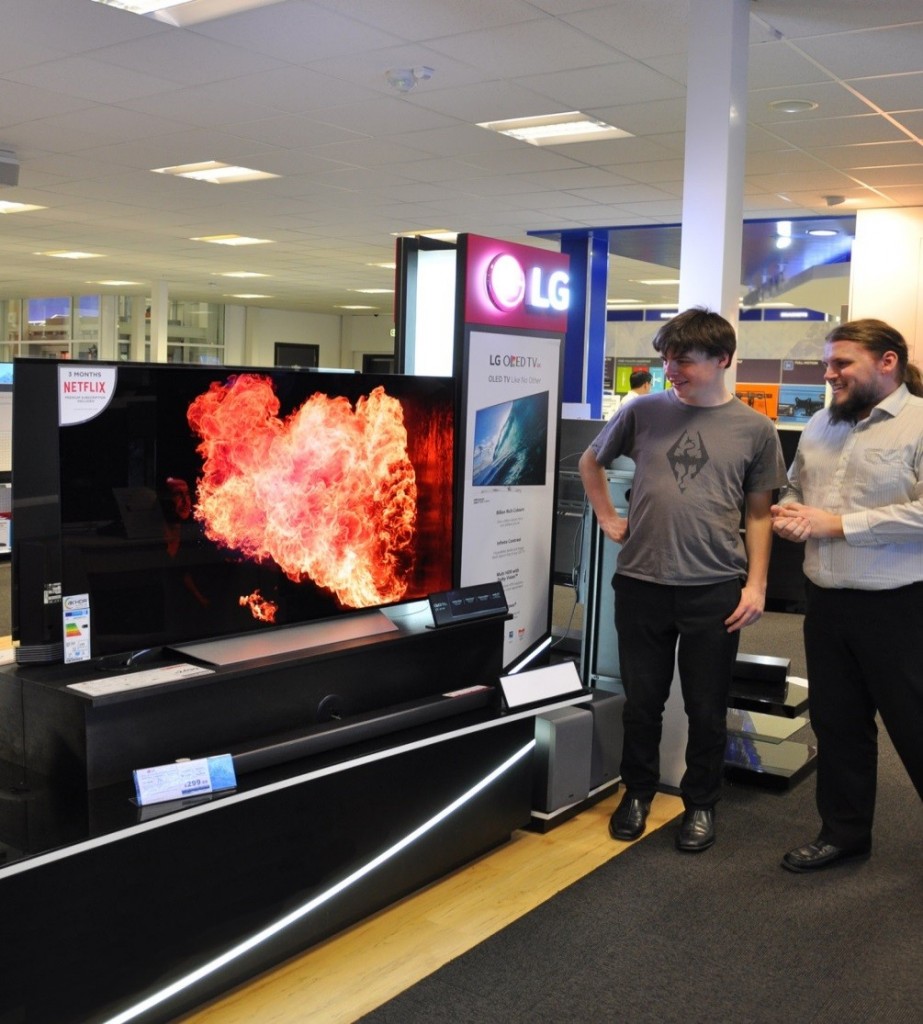 Visitors to LG’s IFA booth admiring an LG OLED TV and its incredible picture quality