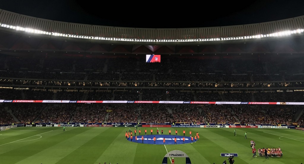 A wide view of Atletico de Madrid’s football stadium with LG’s signage in the background.