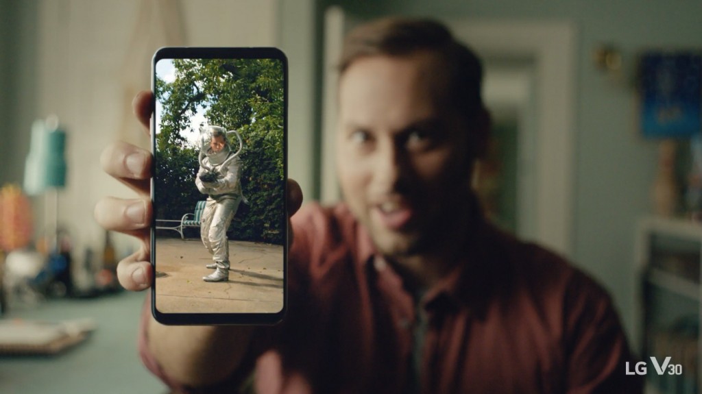 An image from the video clip shows a man holding LG V30 out towards the screen