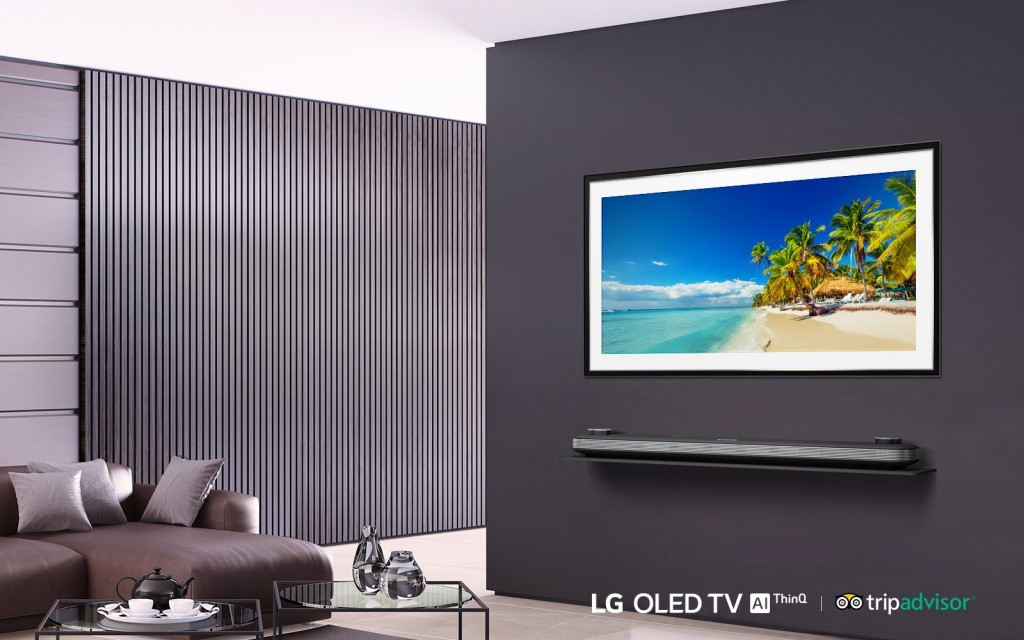 LG SIGNATURE OLED TV W in a modern-designed living room displays the tropical beach with coconut trees on its screen.