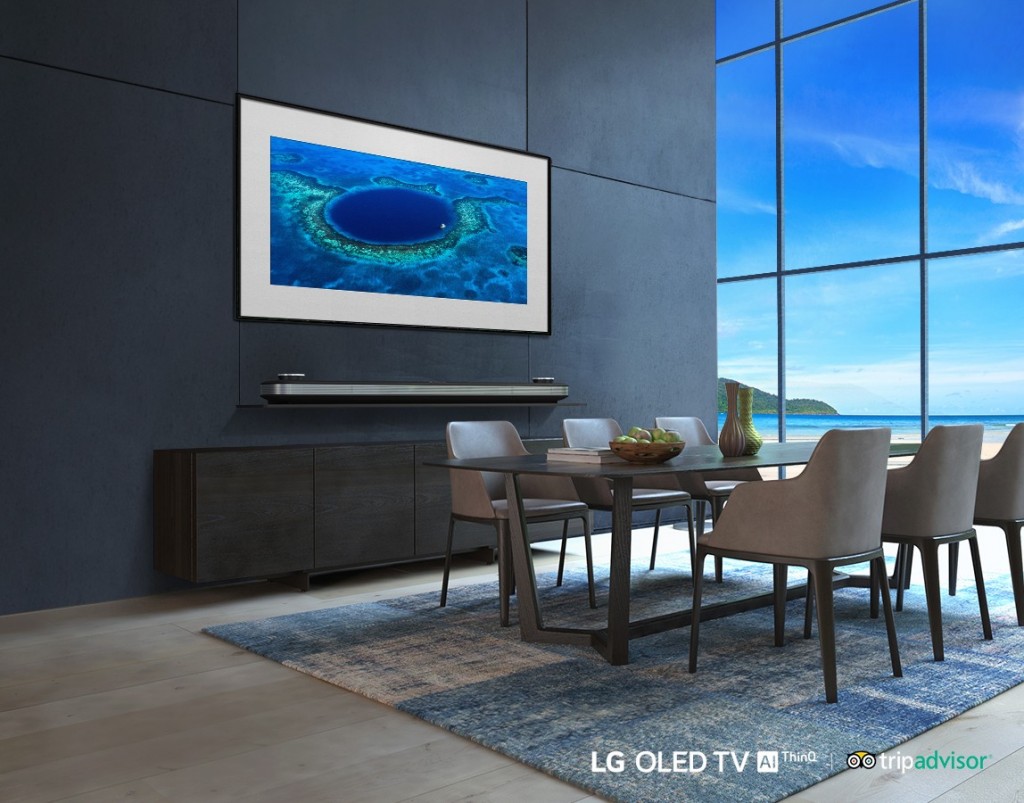 LG SIGNATURE OLED TV W in a modern-designed kitchen displays an image of Belize's Great Blue Hole on its screen.