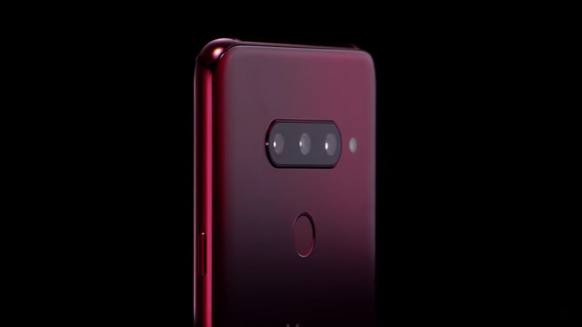 The top, rear half of the LG V40 ThinQ in Carmine Red, showing off the microscopic pits on the rear glass of the LG etched by employing the proprietary Silky Blast™ treatment