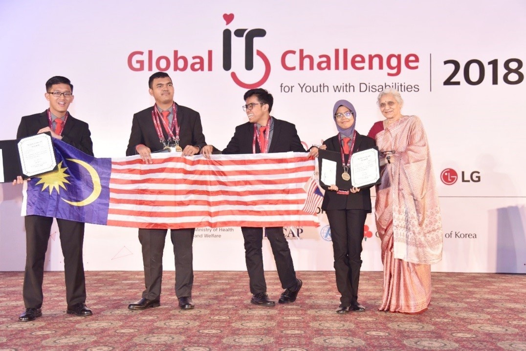 Challenge winners from Malaysia hold up their national flag and the award certificate.