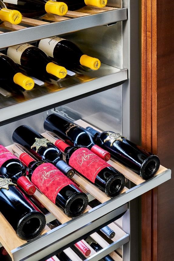 A look inside the Signature Kitchen Suite lineup’s wine cellar, which is full of wine bottles.