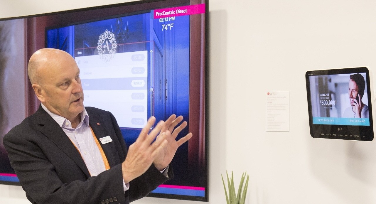 An event attendant explains the intuitive LG Pro:Centric platform.