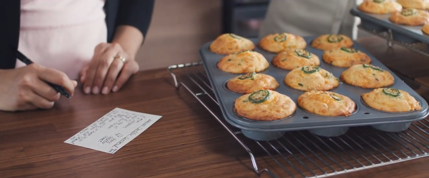 Freshly-baked cookies are placed on the oven tray.