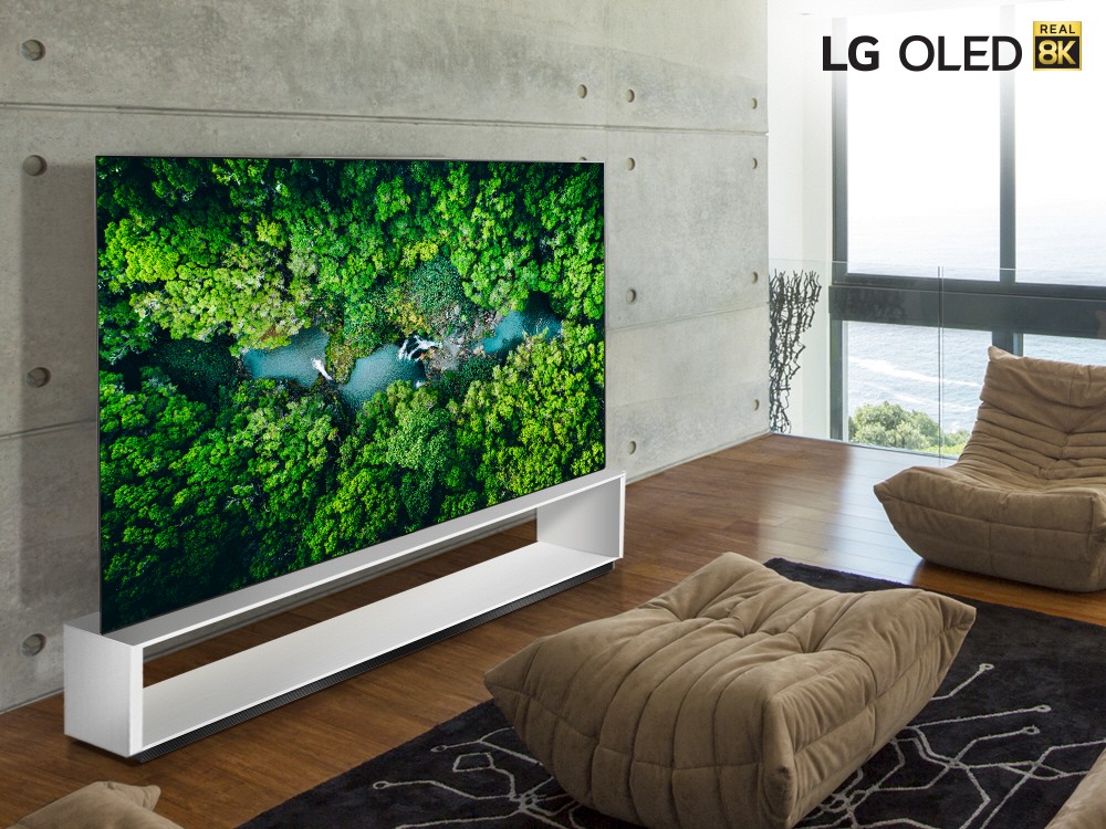 LG 8K OLED TV model 88 OLED ZX in a modern living room while displaying the vivid colors of a dense green forest.