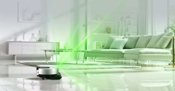 A promotional image of LG CordZeroThinQ beaming green light over the living room as it scans the room.