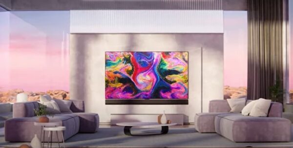 The LG GX Gallery series TV displaying colorful artwork in a modern and open living room