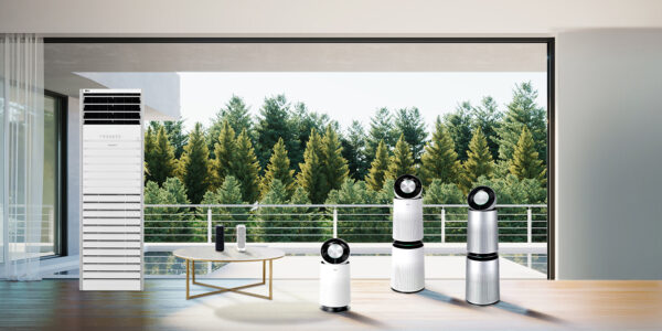 A whole lineup of LG PuriCare, including the big capacity commercial model, PuriCare Mini air purifiers, PuriCare 360 models and PuriCare Pet, standing in a living room with a green scenery
