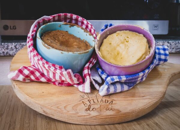 Two recently prepared souffles placed on a pizza board in front of the LG NeoChef microwave oven