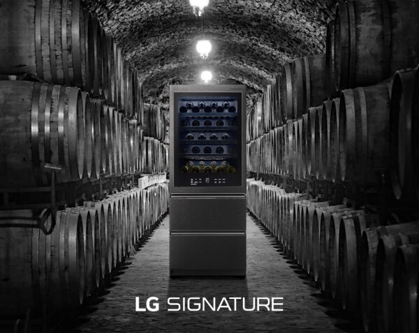 LG SIGNATURE Wine Cellar standing in the middle of a more traditional wine cellar full of wine barrels