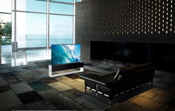 LG SIGNATURE OLED R positioned in a modern living space while vividly displaying crashing waves