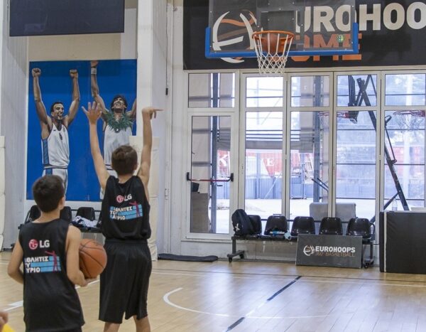 Children shooting the basketball during the LG Athletes of Tomorrow program