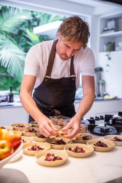 Chef Darren Robertson making the finishing touches to his dishes at Australia’s LG SIGNATURE Home