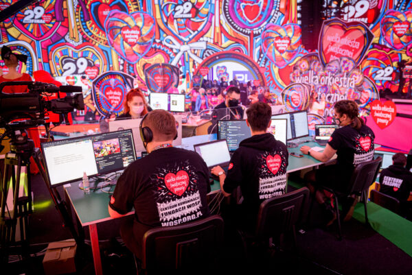 Volunteers at the 29th Annual Grand Finale fundraiser using the monitors provided by LG to support the online fundraising.