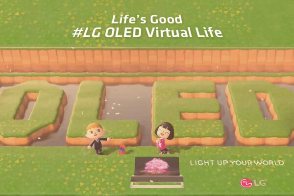 Two player avatars in popular Nintendo game 'Animal Crossing' pose with the LG OLED TV and 'OLED’ lettering, which have been terraformed into the pond behind them.
