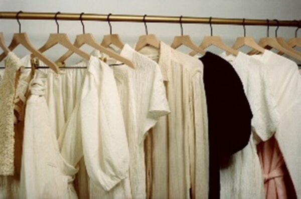 Elegant and sustainable women's clothing hanging on a rack.