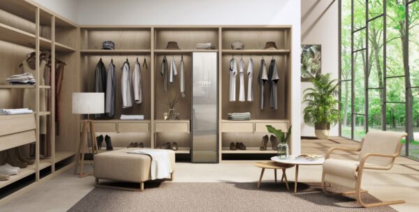 LG Styler effortlessly blending into a modern dressing room with smart clothes hanging up on either side