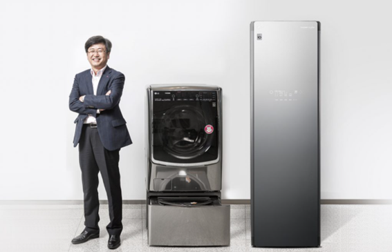 Dong-won Kim, Ph.D. Laboratory Leader of Living Appliance R&D Lab at LG, standing proudly next to the LG TWINWash and LG Styler appliances he invented.