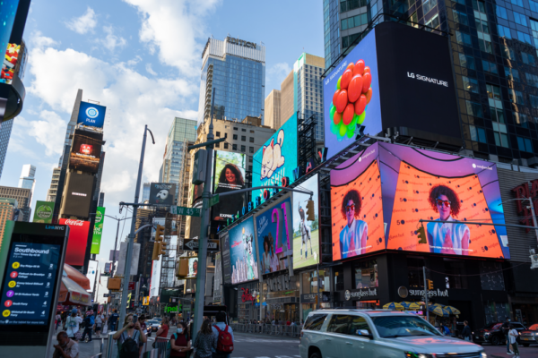 LG's digital billboard in Time Square, New York displaying an animation of plump grapes representing the function of LG SIGNATURE Wine Celler