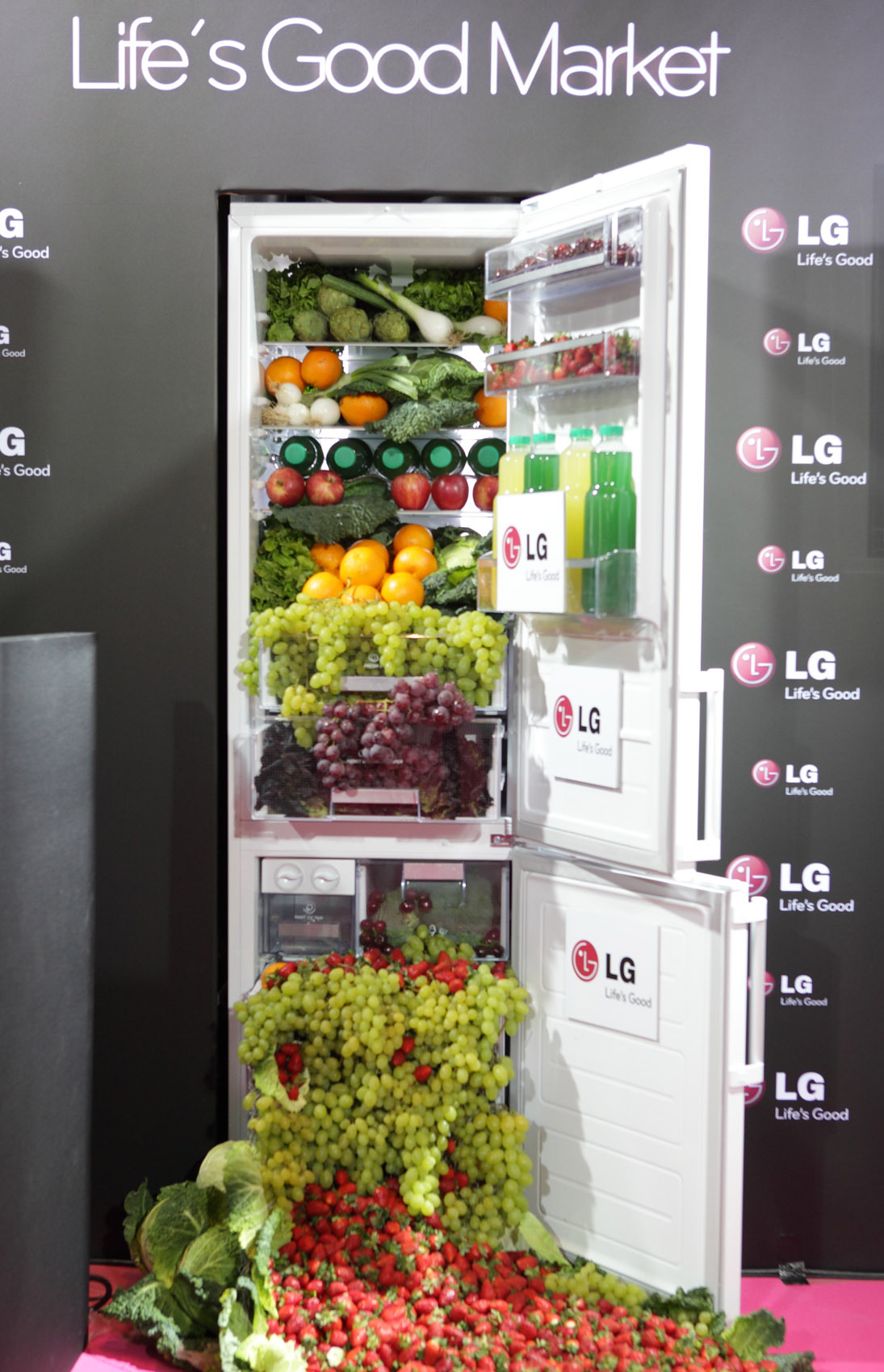 The LG refrigerator display in…, with healthy fruits, vegetables and juices flowing from the appliance’s interior like a waterfall.