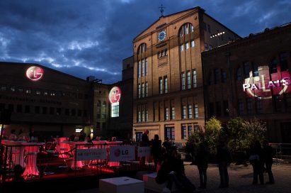 Three gigantic 3D LG logos projected onto the front wall of buildings in Kulturbrauerei, the cultural heart of Berlin