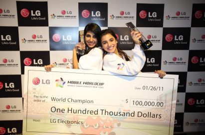 Winners of the LG Mobile Worldcup Championship 2010-2011, Cristina Sales Ancines and Jennifer Sales Ancines from Panama, pose with their award and winnings