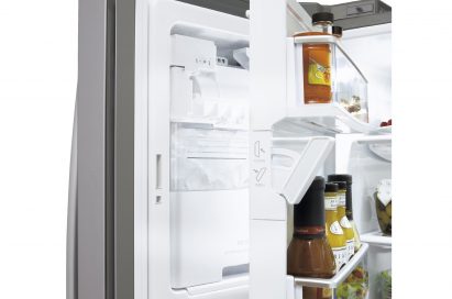 Side close-up view of LG new Four-Door French-Door refrigerator’s door bin space opened showing its Slim SpacePlus™ Ice System