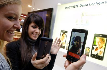 Two female models are demonstrating Video Call via LTE in LG’s booth