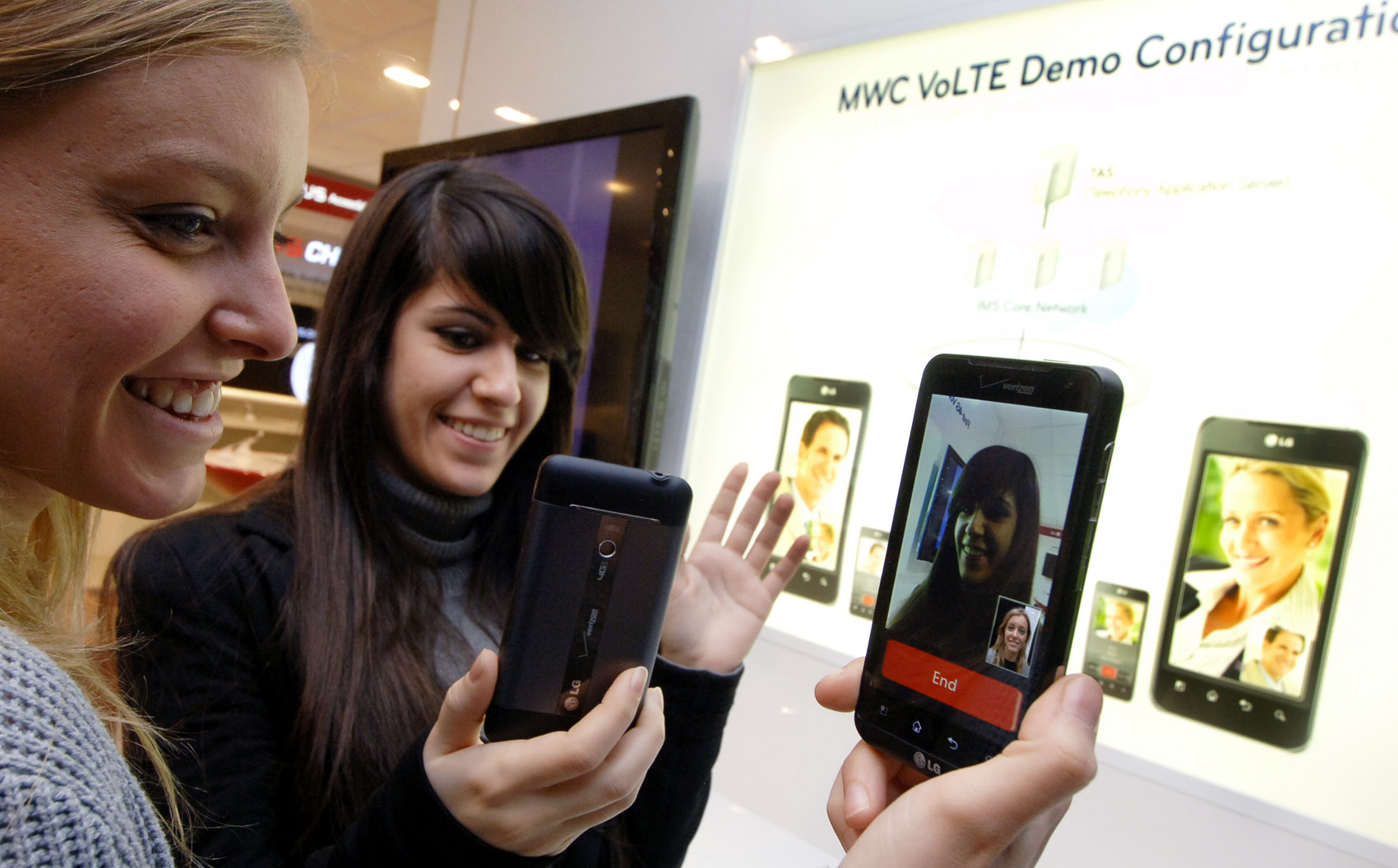 Two female models are demonstrating Video Call via LTE in LG’s booth