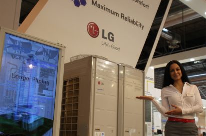 A woman posing in front of LG’s commercial air conditioning appliances