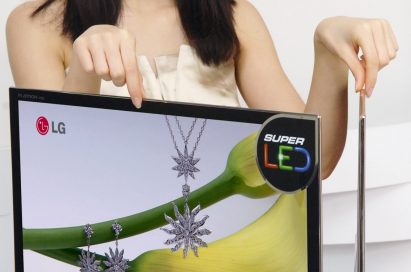 A model posing with two LCD LED Monitor model E90s positioned on a desk