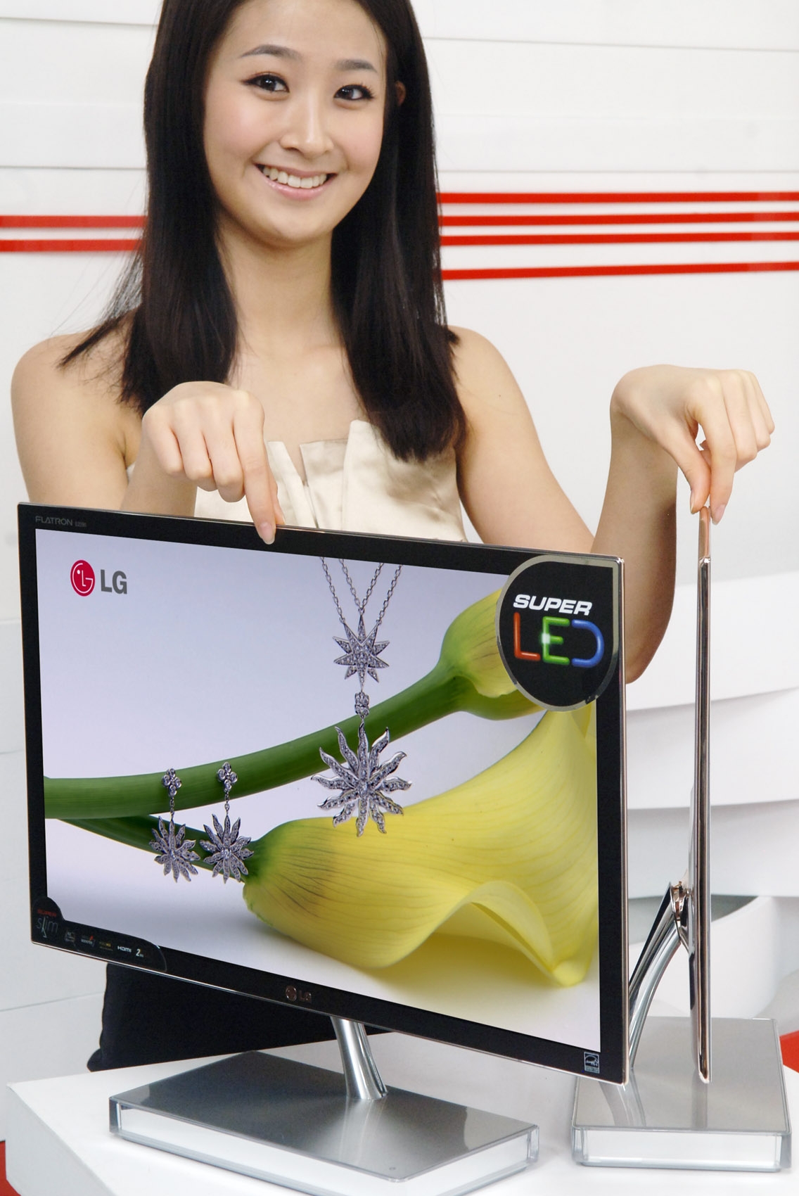 A model posing with two LCD LED Monitor model E90s positioned on a desk