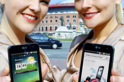 Two female models hold LG Optimus 2Xs and show its front views