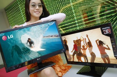 A model wearing 3D glasses presents two LG Cinema 3D Monitors