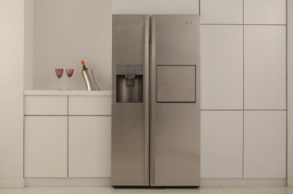 Front view of the LG Side-by-Side Refrigerator placed in a modern kitchen