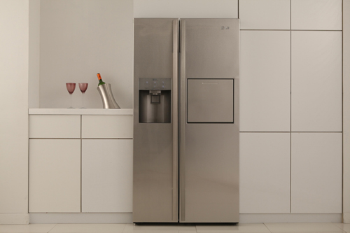 Front view of the LG Side-by-Side Refrigerator placed in a modern kitchen