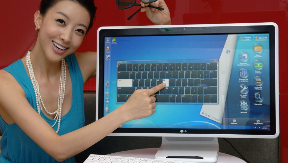 A model is posing with the LG all-in-one PC model V3001