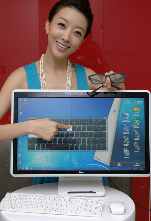 A model is posing with the LG all-in-one PC model V3001