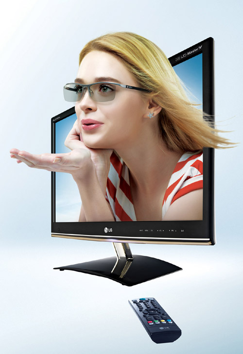 A model wearing 3D glasses breaking out of the LG 3D monitor’s (DM50D) display.