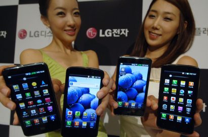 Two female models hold LG Optimus 3Ds and show its front views