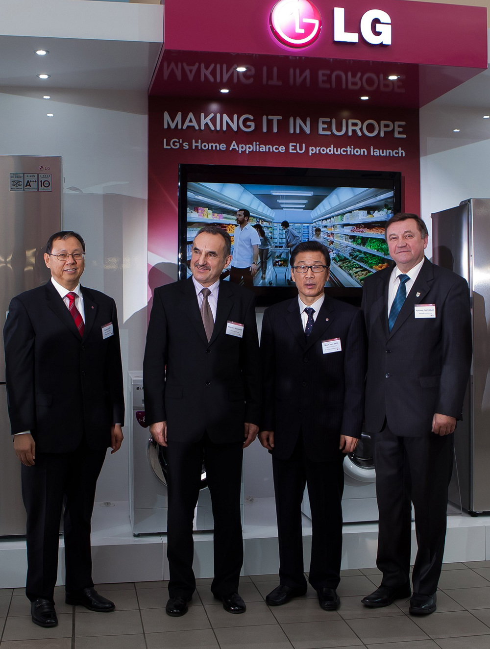 A group of LG executives poses to celebrate on the launch of LG’s Home Appliance production facility in Poland.