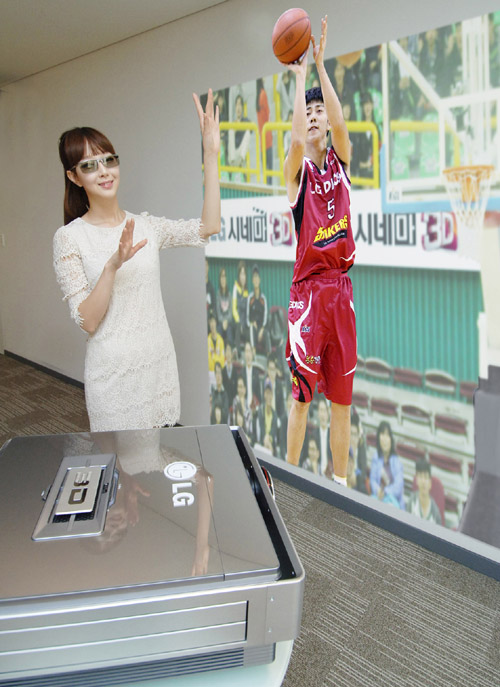 A model wearing 3D glasses while experiencing the CF3DAT CINEMA 3D projector, which is projecting a basketball player taking a shot