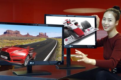 A model presents two of LG’s 25-inch Glasses-Free 3D monitors