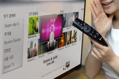 A close-up of a model demonstrating LG’s new Magic Remote with the LG CINEMA 3D Smart TV